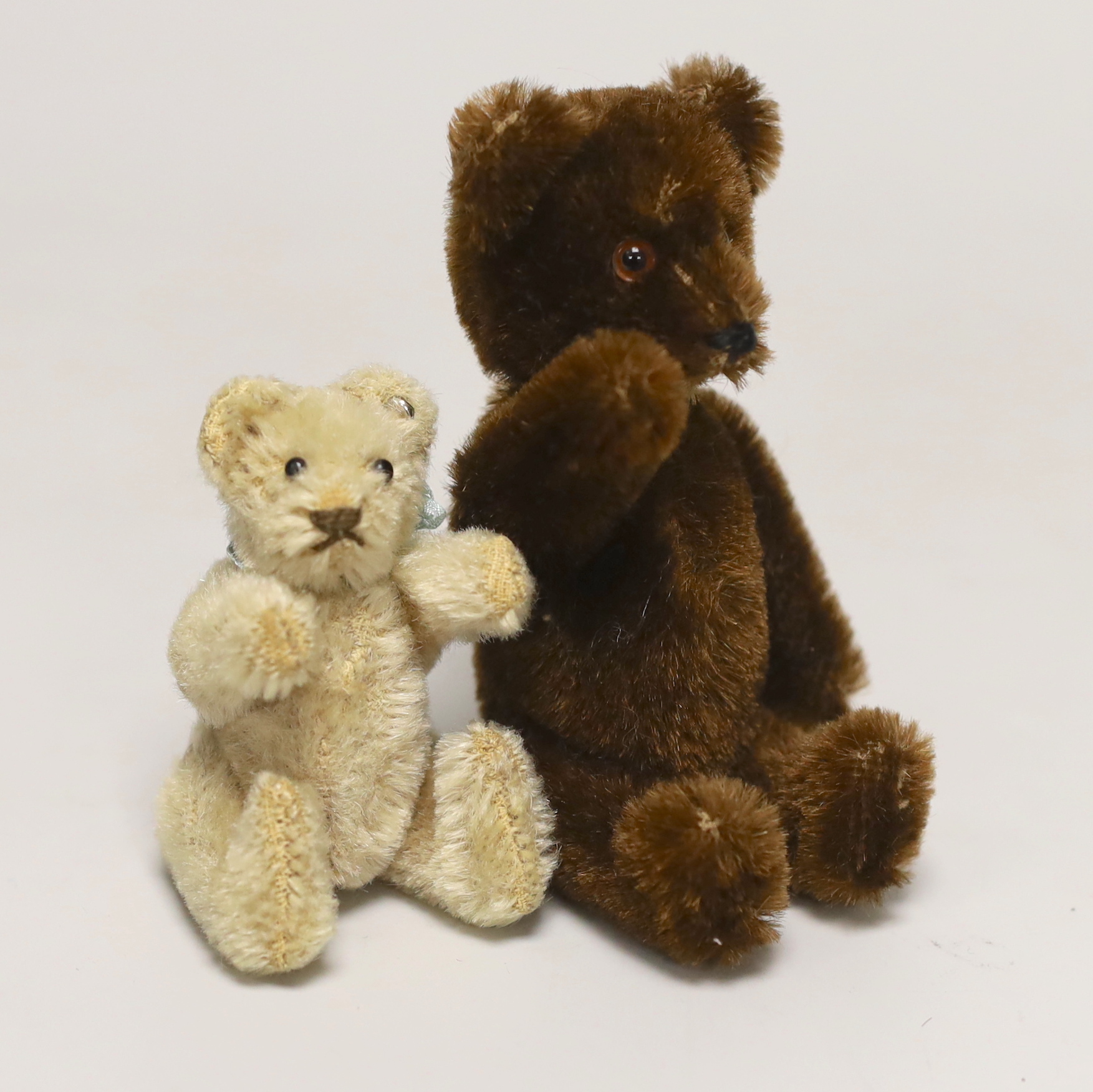 A Schuco Yes/No brown mohair, 1950's, 5in., excellent condition, and a 1950's Steiff bear with button, 3in., excellent condition